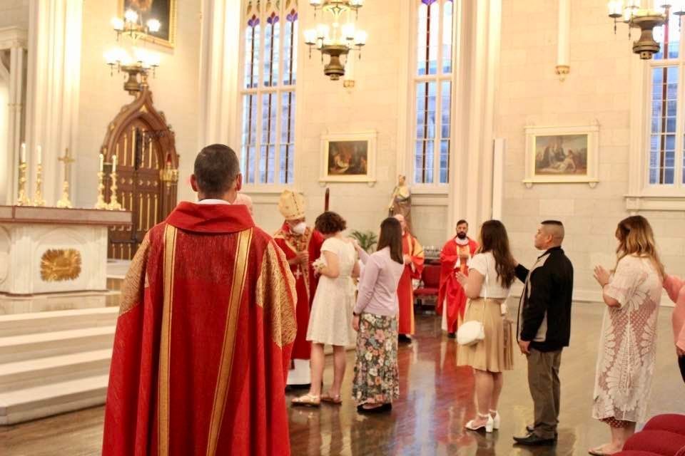 People lined up before the altar, ready for confirmation