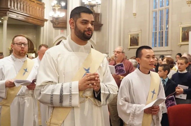 Man being ordained in church